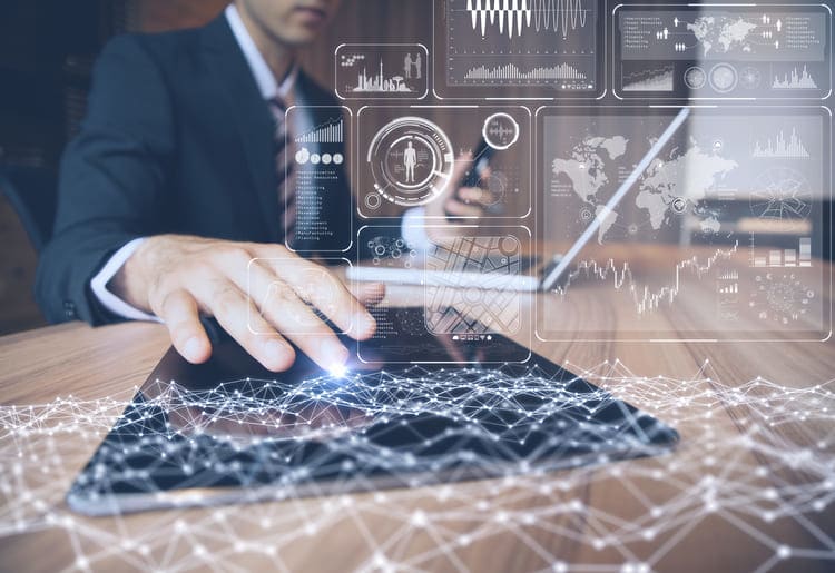 Businessman using a control panel, looking at web analytics.