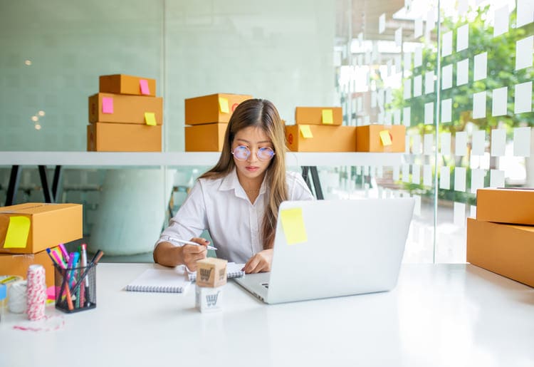 E-commerce owner working from home office.