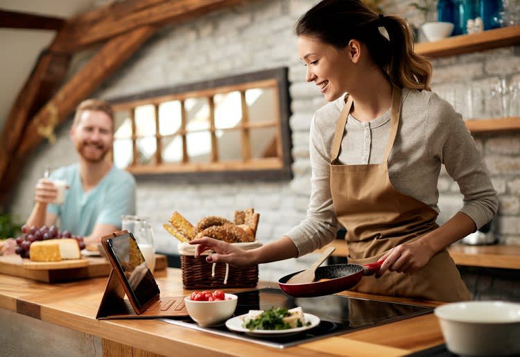 Woman using a Home Chef alternative to prepare a meal