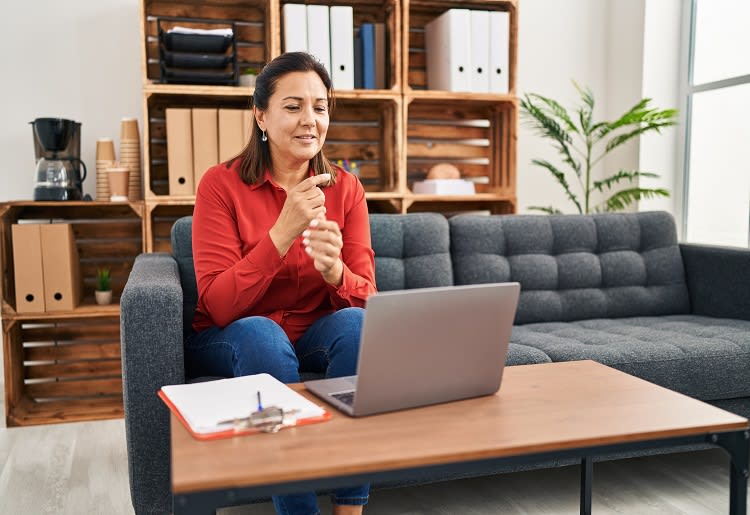 A psychiatrist conducting an online therapy session