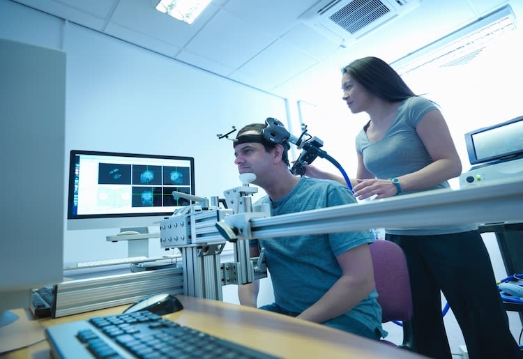 Doctor using TMS to treat a patient with major depressive disorder.