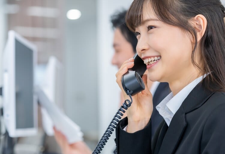 Woman at work on a phone.
